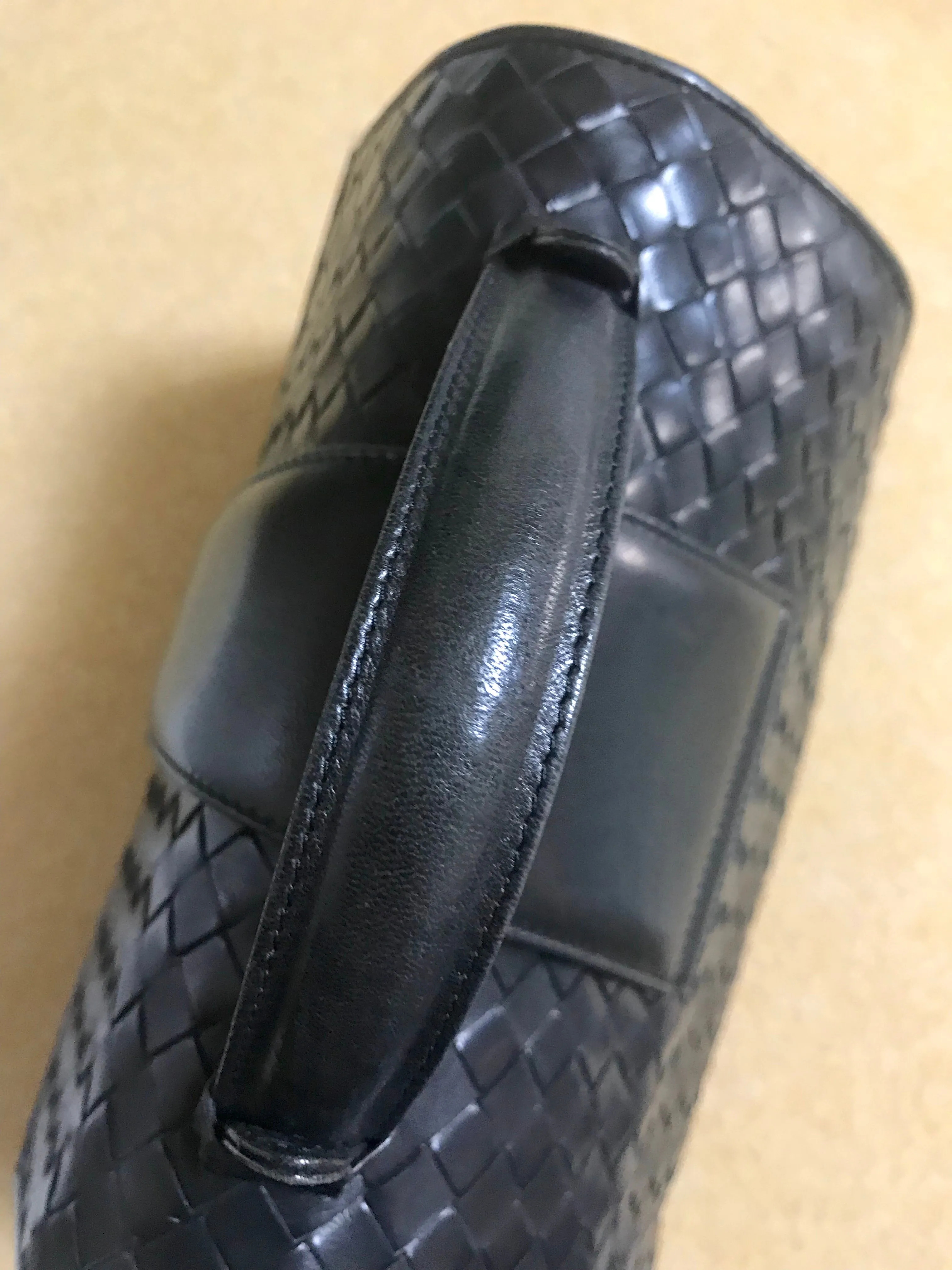 1990s. Vintage Bottega Veneta classic black lamb leather intrecciato handbag with golden closure hock. Gorgeous masterpiece from Bottega.