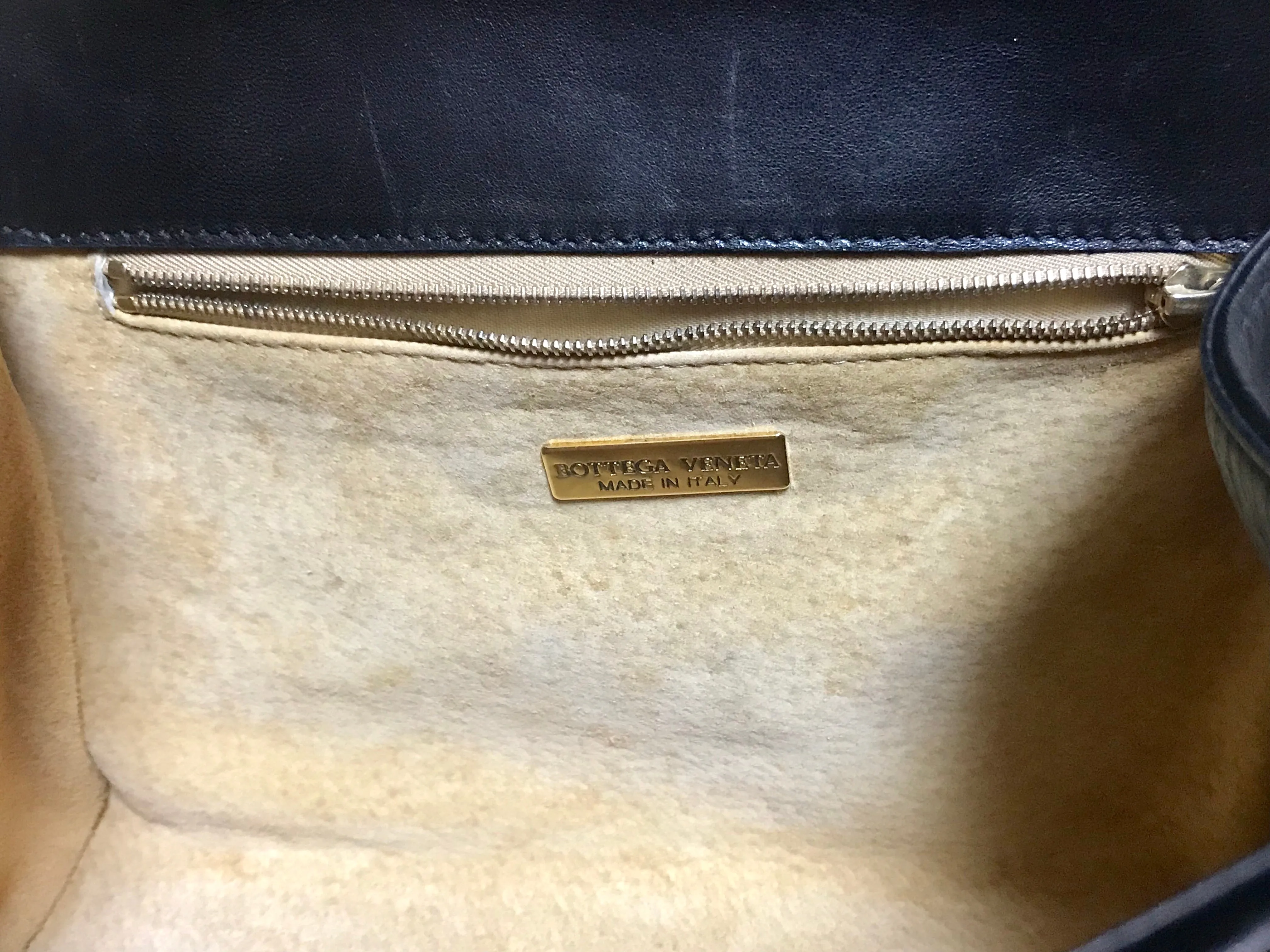 1990s. Vintage Bottega Veneta classic black lamb leather intrecciato handbag with golden closure hock. Gorgeous masterpiece from Bottega.