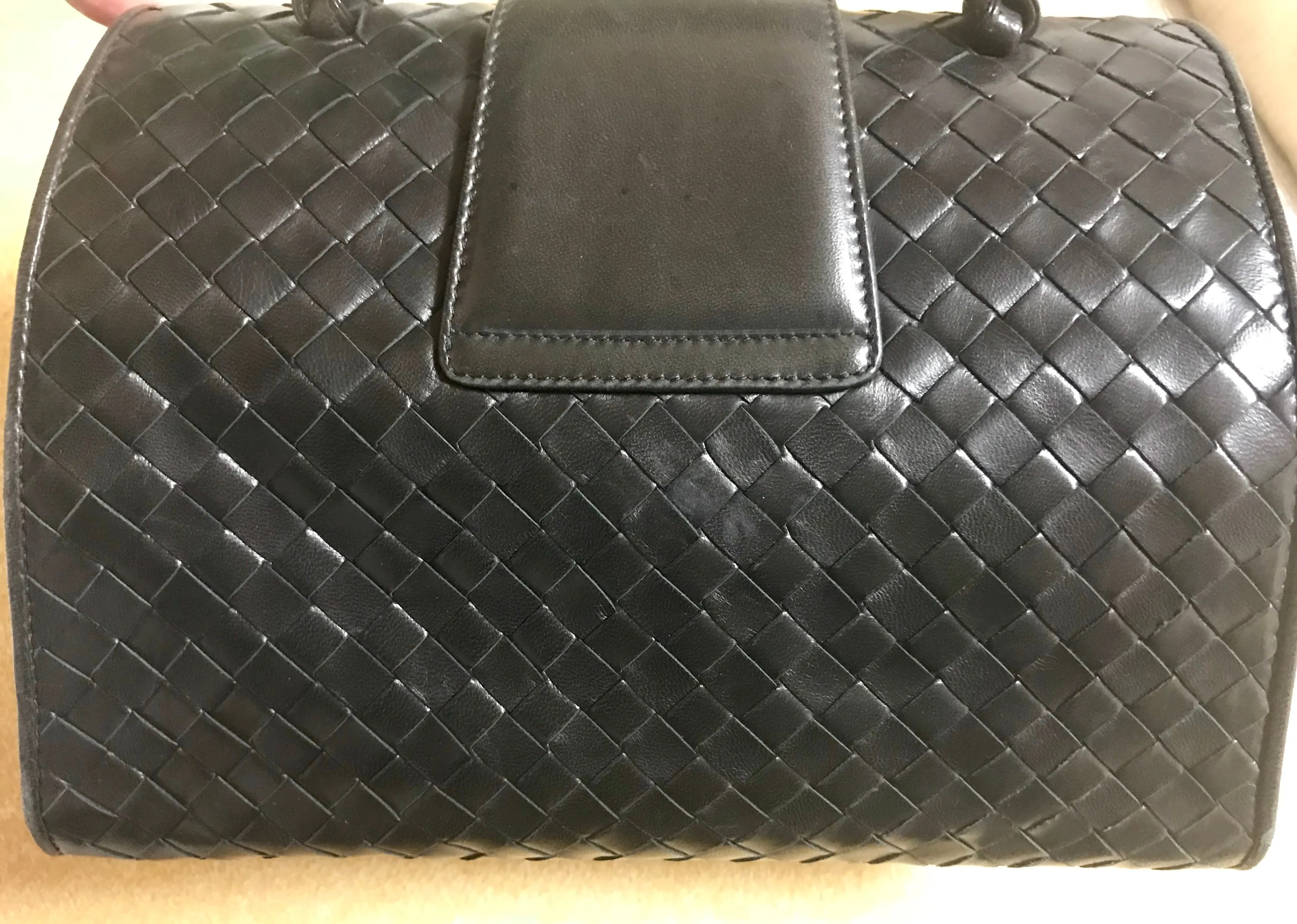 1990s. Vintage Bottega Veneta classic black lamb leather intrecciato handbag with golden closure hock. Gorgeous masterpiece from Bottega.