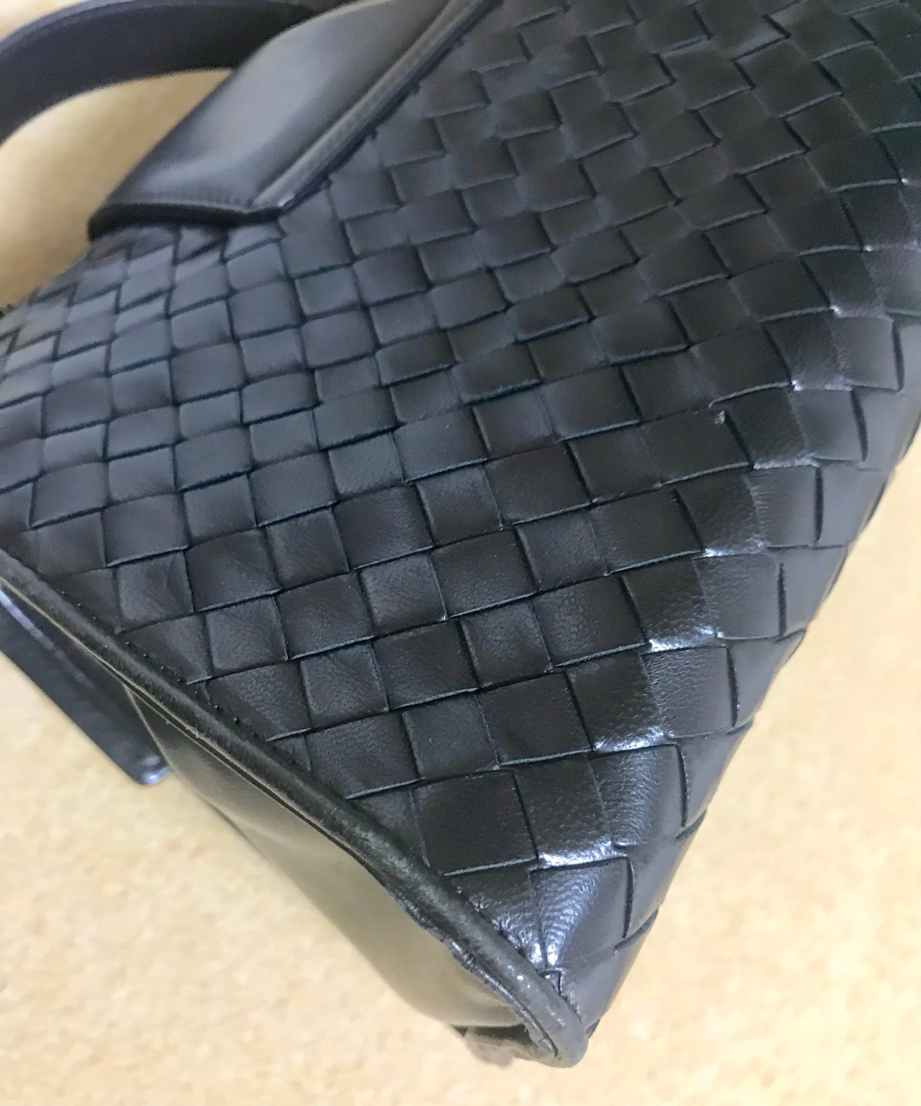 1990s. Vintage Bottega Veneta classic black lamb leather intrecciato handbag with golden closure hock. Gorgeous masterpiece from Bottega.