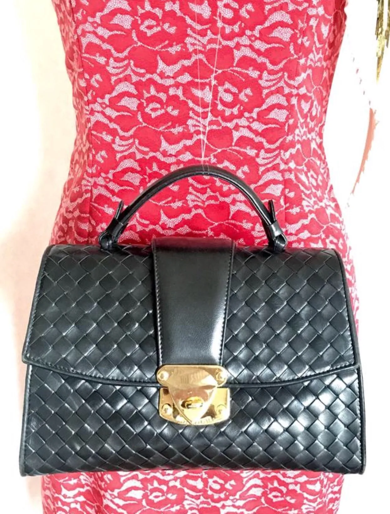 1990s. Vintage Bottega Veneta classic black lamb leather intrecciato handbag with golden closure hock. Gorgeous masterpiece from Bottega.